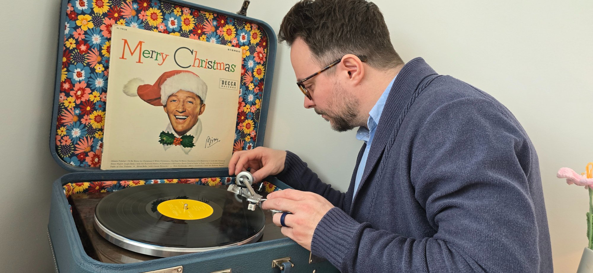Jordan setting up a vintage record player — Helping Hand Tech helps with old and new technology